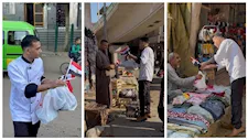 طباخ يوزع وجبات مجانية وأعلام مصر في شوارع الباجور احتفالا بنصر أكتوبر -صور
