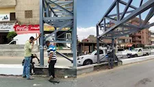 فك بوابة كوبري الباجور العلوي بعد ساعات من تركيبها بالمنوفية -صور