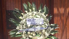 باقة من الورود.. حضور رمزي للرئيس الفلسطيني في جنازة هاني شاكر  