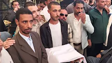 بالصور.. "الكفن" ينهي 5 سنوات من النزاع بين عائلتين في أسيوط