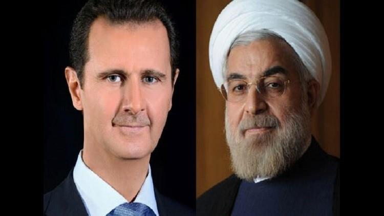 الأسد يهنئ روحاني