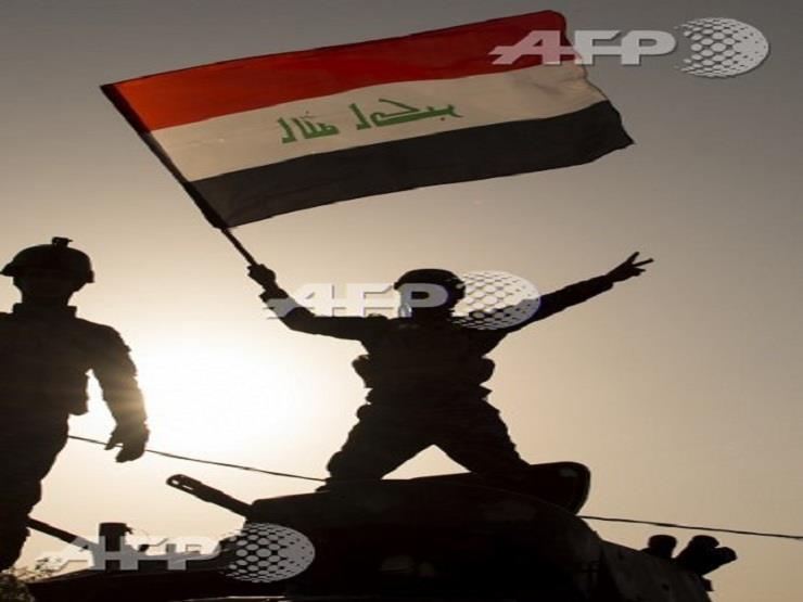 جندي عراقي يعلن الانتصار  (أ ف ب)