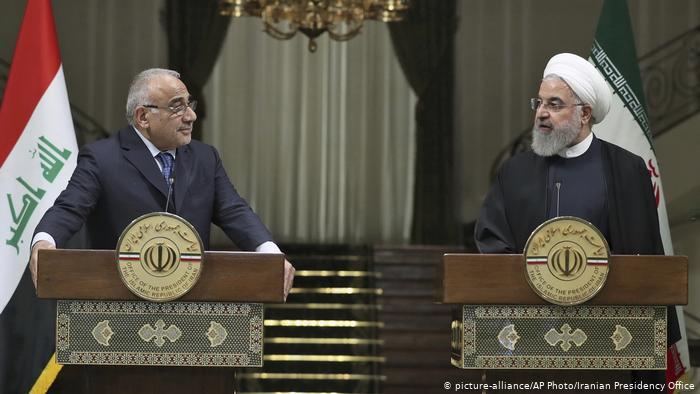 لقاء سابق بين الرئيس الإيراني حسن روحاني ورئيس الو
