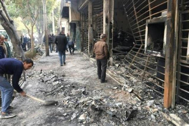 مصرف تعرض للحرق في مدينة إصفهان الإيرانية في 17 تش