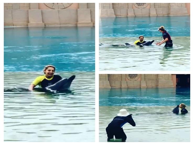 مي حلمي مع الدلافين في دبي