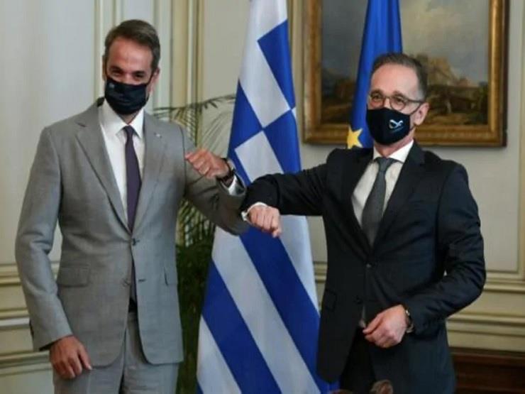 رئيس الوزراء اليوناني كيرياكوس ميتسوتاكيس ووزير ال