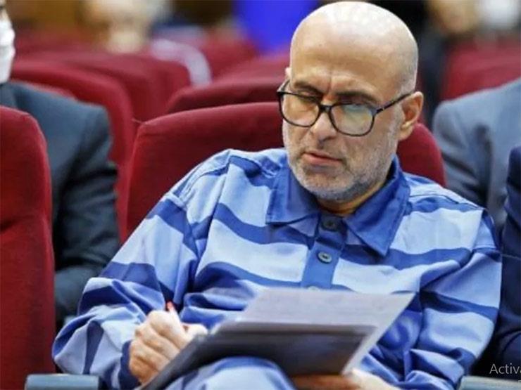 أكبر طبري خلال محاكمته في طهران