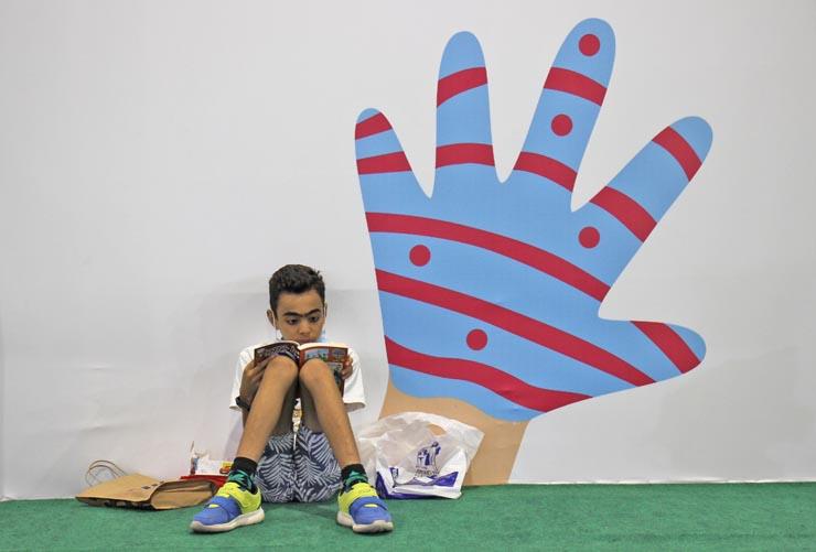  الطفل يوسف أحمد ينهي قصة جديدة بمعرض الكتاب