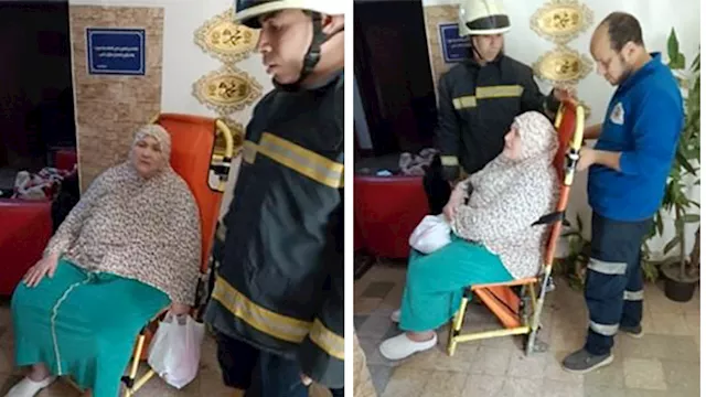 أمن القاهرة ينقل سيدة مريضة للمستشفى تعثرت حركتها