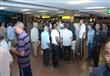 بالصور- عودة المصريين العاملين بليبيا إلي مطار القاهرة