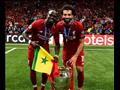 محمد صلاح وساديو ماني مع كأس دوري أبطال أوروبا                                                                                                                                                          