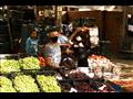التزام تجار سوق الجملة بأكتوبر بارتداء الكمامات