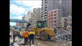 رفع أكوام القمامة من مسار مترو الإسكندرية (5)