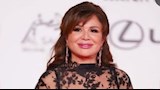 الفنانة إلهام شاهين مرتدية فستان سهرة أسود 