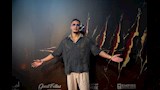 محمد رمضان أمام بوستر فيلم أسد