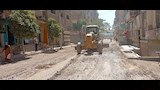 بدء رصف شارع مجلس المدينة القديم بمدينة منفلوط لتحسين الحركة المرورية والخدمات