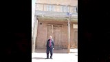 نجل محمد خليفة أمام مقر البنك