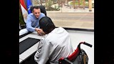 محافظ أسوان يصافح مواطن من ذوى الهمم ويستمع لمشكلته