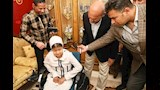 محافظ السيوس ونائبه خلال تقديم الطرسي للطفلة