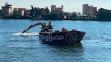 بالصور- استمرار تطهير فرع رشيد من ورد النيل والحشائش بكفر الشيخ