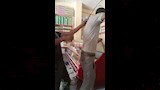 مواطين بحاول التدخل وامساك الكرباج لوقف الاعتداء على الشاب