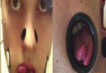 شاب ألماني يثقب خديه لإظهار أسنانه ولسانه المشقوق