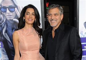 بالصور- جورج كلوني وزوجته ينقذان كلب من مصير سيء