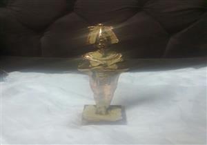 ضبط عاطل بحوزته ثمثال أثري - صورة