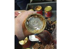 ضبط صاحب شركة حاول تهريب نصف مليون جنيه داخل معلبات "تونة"