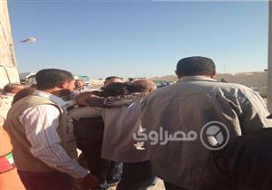 بالصور.. سائق يهدد بالانتحار من أعلى برج بمصنع السكر في كفر الشيخ