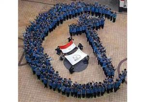 تلاميذ بالإسكندرية يشكلون بأجسادهم ''الهلال والصليب'' في طابور الصباح