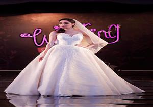 "القبعات"..أحدث صيحات فساتين السهرة والزفاف في مهرجان our wedding 2018 