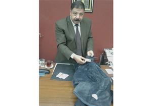 إحباط تهريب "فرش حشيش" في ياقة جاكت بمطار القاهرة - صورة