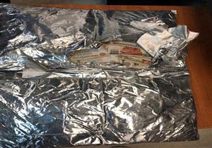 إحباط تهريب 650 ألف جنيه داخل ورق ألومنيوم في مطار القاهرة 