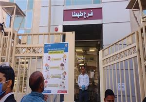 بالصور.. منشورات توعية بكورونا في أماكن صرف المعاشات بسوهاج 