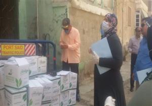 بالصور.. تسليم البحوث وصرف معاشات سكان عمارات الحجر المنزلي في بورسعيد