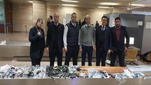 ضبط أقراص مخدرة و7 بنادق صيد تحت الماء مع راكبين بمطار القاهرة