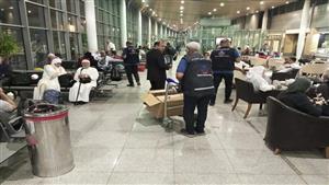 بالصور- الحجر الصحي بالإسكندرية يودع فوج أول رحلة حج من مطار برج العرب