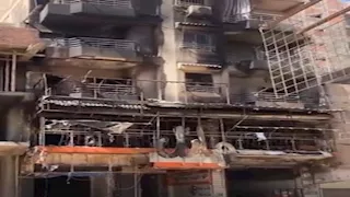 حريق عقار فيصل.. المعاينة: النار بدأت بسنتر ملابس وامتدت لمحل أحذية | صور 