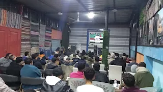 "صافية كفر الشيخ" تترقب لمسات ابنها اللاعب محمود صابر أمام أنجولا (صور)