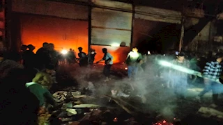 5 مصابين في حريق محلات تجارية بشارع البستان بأسيوط- صور