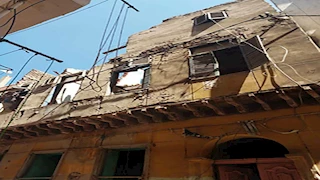 إزالة أجزاء من عقارين آيلين للسقوط غرب الإسكندرية - صور