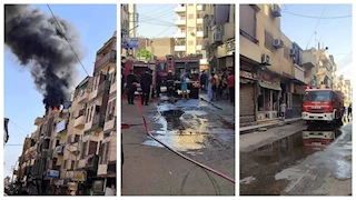 اندلاع حريق أعلى سنتر تجاري بشارع رمسيس في الأقصر -صور