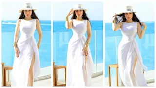 صور- ياسمين عز بفستان جريء بفتحة ساق على البحر في مراسي