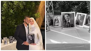 ابنة محمد مرزبان تحمل صورة والدها الراحل في حفل زفافهار