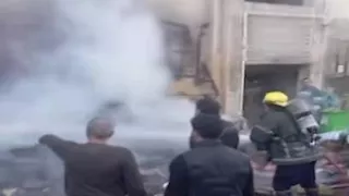 بالصور- السيطرة على حريق في أجولة محل عطارة ببورسعيد