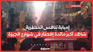 إمبابة تنافس المطرية.. شاهد أكبر مائدة إفطار في شوارع الجيزة