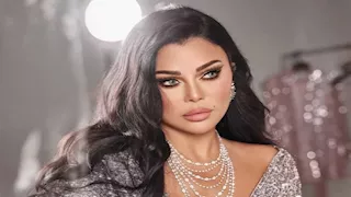 ظهور مفاجئ لـ هيفاء وهبي بفستان أبيض وطرحه والجمهور: "أحلى عروسة"
